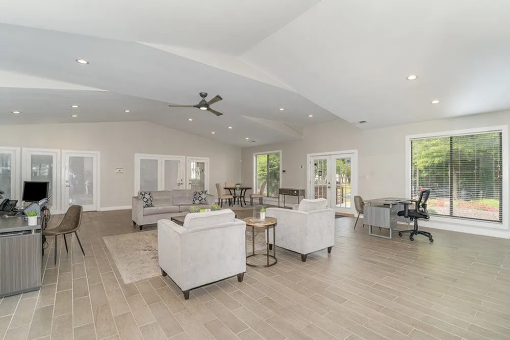 a living room with couches and chairs and a ceiling fan at Village 1373, Greensboro, NC 27455