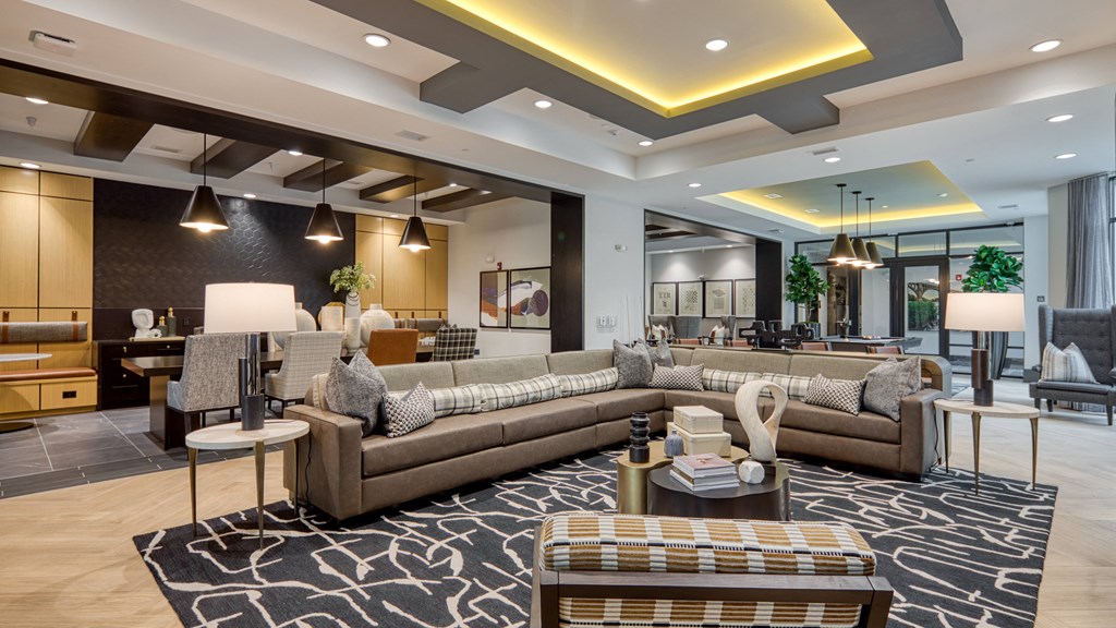 a large living room with couches and tables at Aura Stonebridge, Virginia, 23225