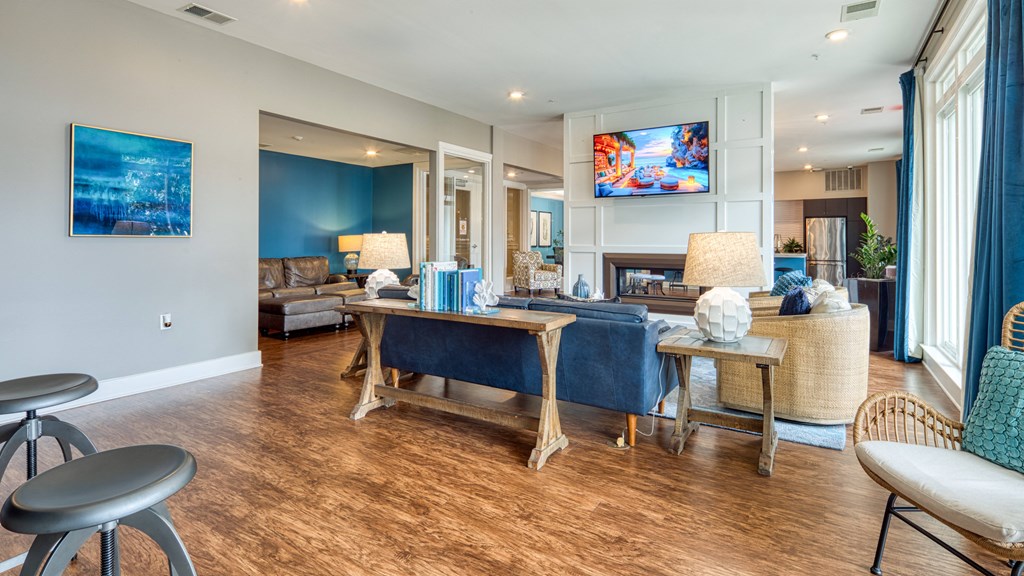 a living room with a couch and a table with chairs