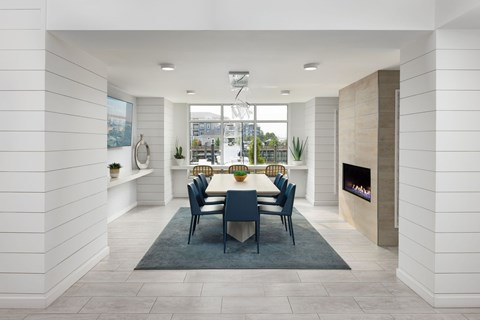 A dining room with a table set for six at The Port at East Beach Apartments and Marina in VA, 23518