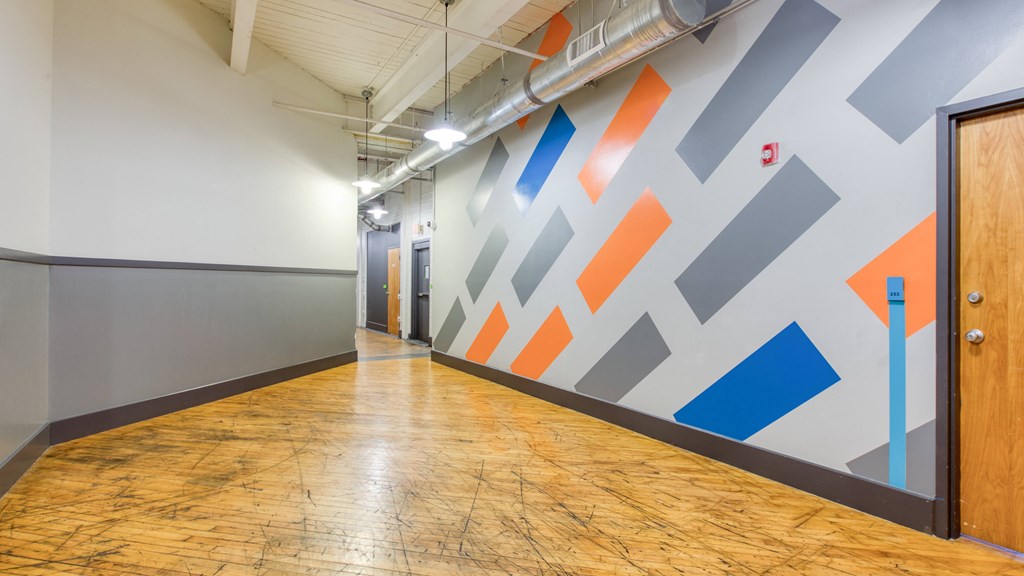 a geometric wall mural in a hallway at The Hudson, Richmond, Virginia