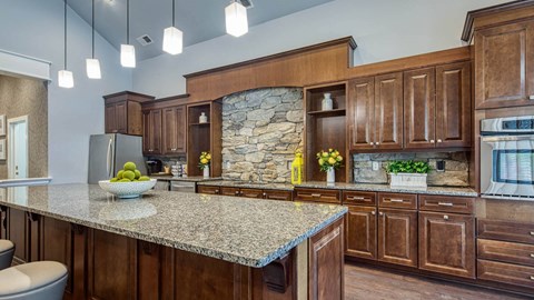 a large kitchen with a granite counter top