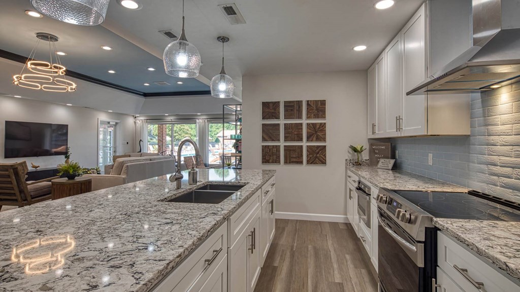 a kitchen with granite counter tops and a sink
