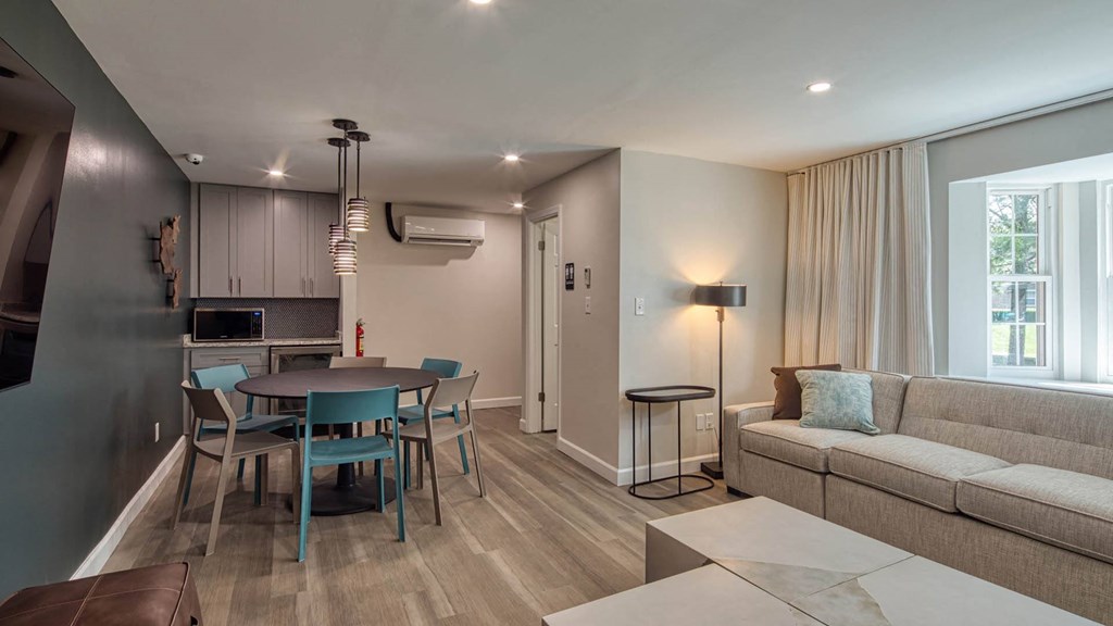 a living room with a table and a couch