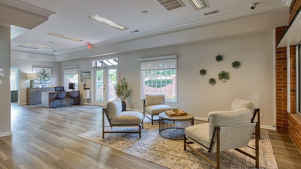 a living room with two chairs and a table