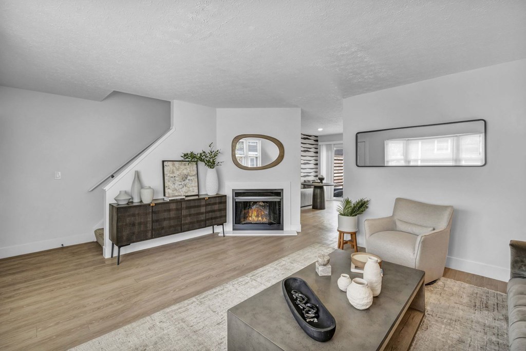 A living room with a fireplace and a couch.