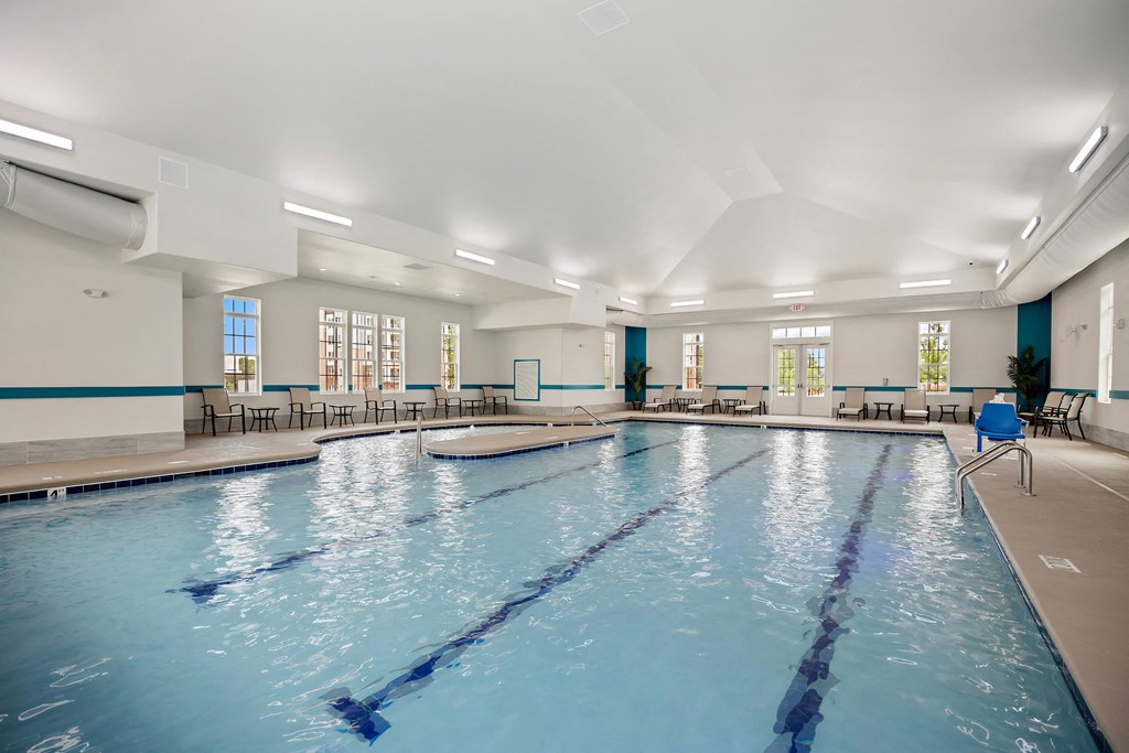 a large swimming pool in a building with a large blue pool at Ellis Station, Durham, North Carolina