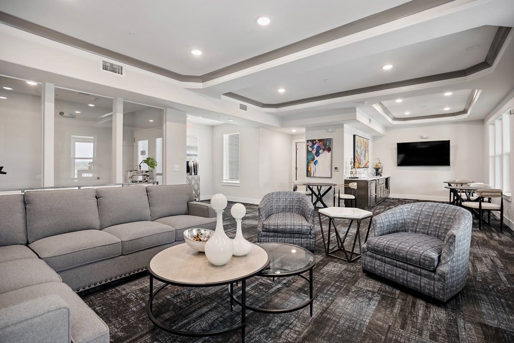 the living room of a new home with couches and chairs at Ellis Station, Durham, North Carolina