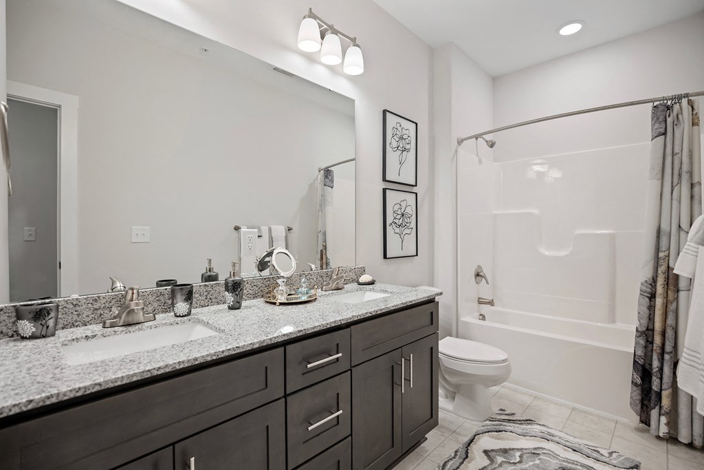 a bathroom with a sink and a shower and a toilet at Ellis Station, Durham, NC
