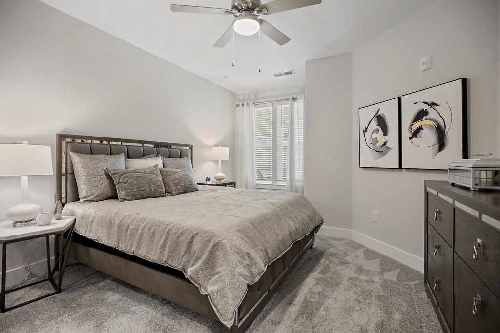 a bedroom with a bed and a ceiling fan at Ellis Station, Durham