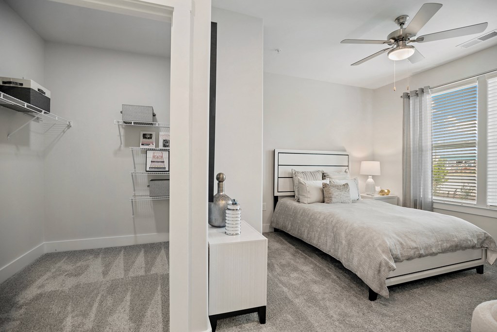 a bedroom with a bed and a ceiling fan at Ellis Station, Durham, NC
