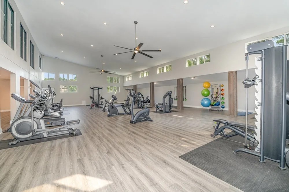 the gym is equipped with treadmills and other exercise equipment at Village 1373, Greensboro, NC 27455