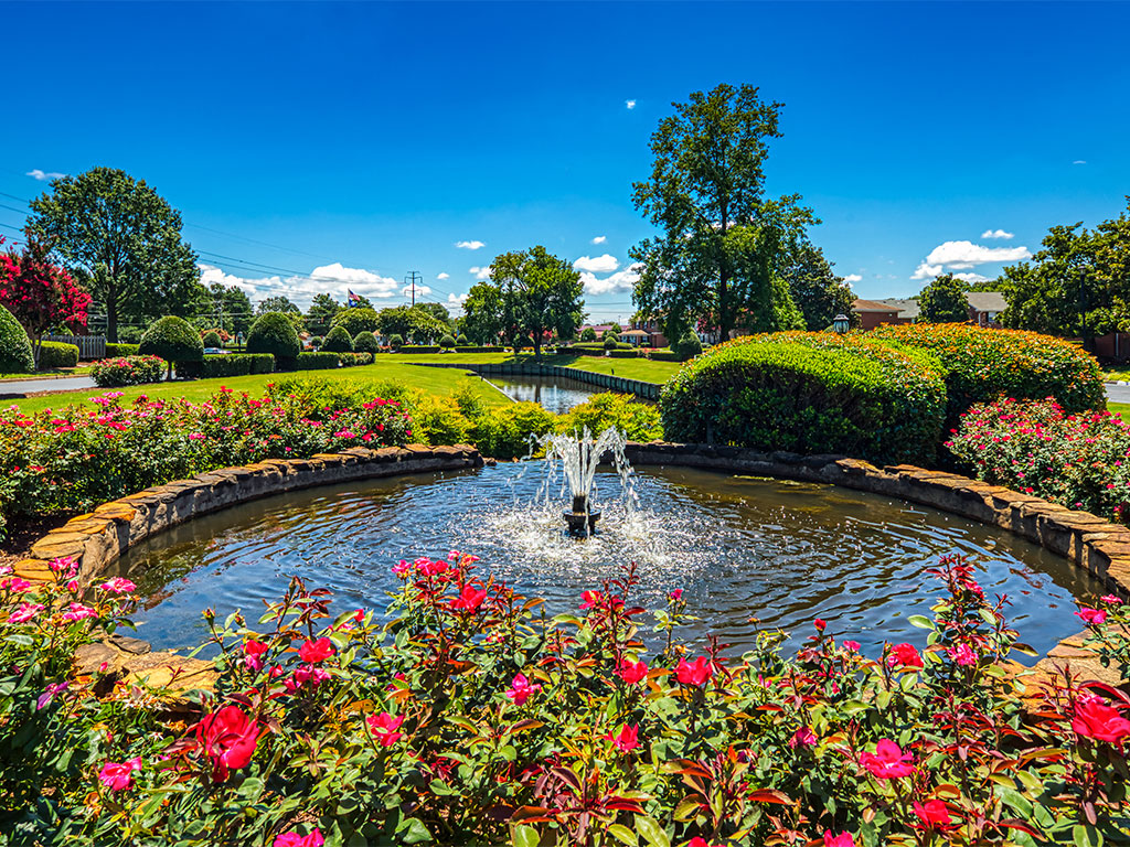 flowers and fountain at Holly Point Apartments in Chesapeake VA