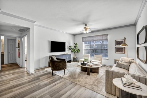 A living room with a brown chair and a brown couch.