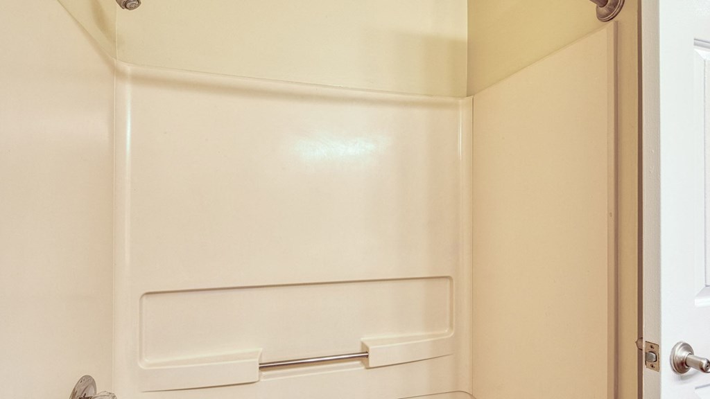 A white door with a handle and a latch.