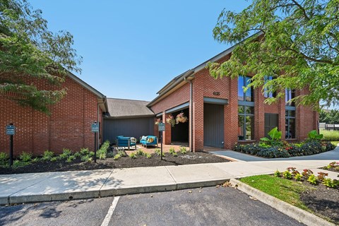 A red brick building with a garage door and a sign that says "Barnes & Noble".