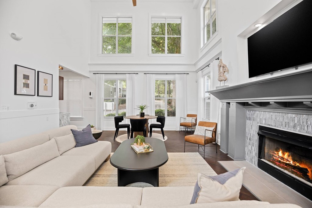 A living room with a fireplace and a couch.
