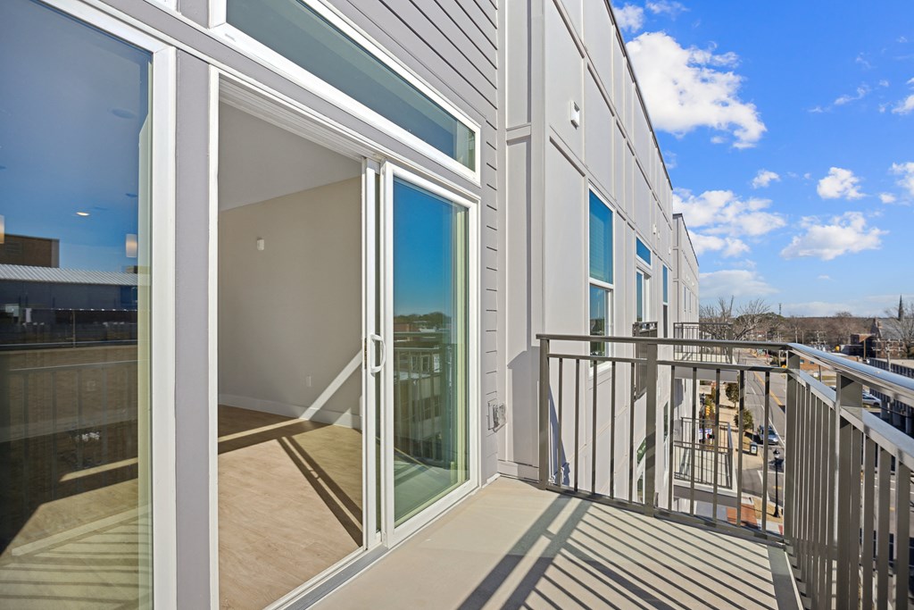 a balcony with a view of a building and a blue skyat Centro at Pine Nash, North Carolina