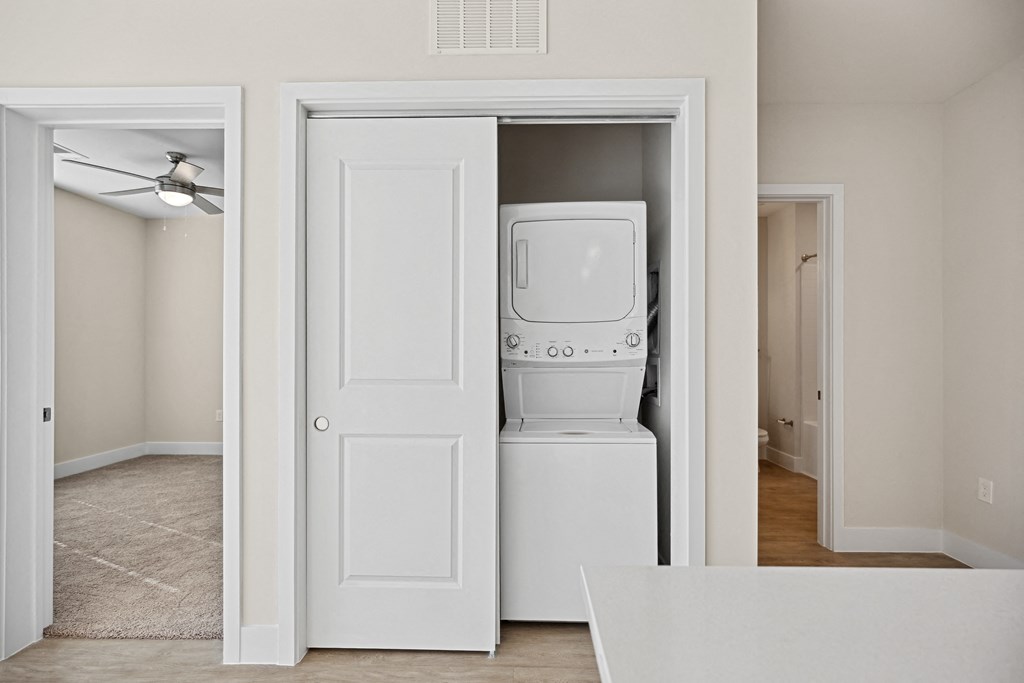 an empty room with a laundry room and a washer and dryerat Centro at Pine Nash, Wilson, NC, North Carolina, 27893
