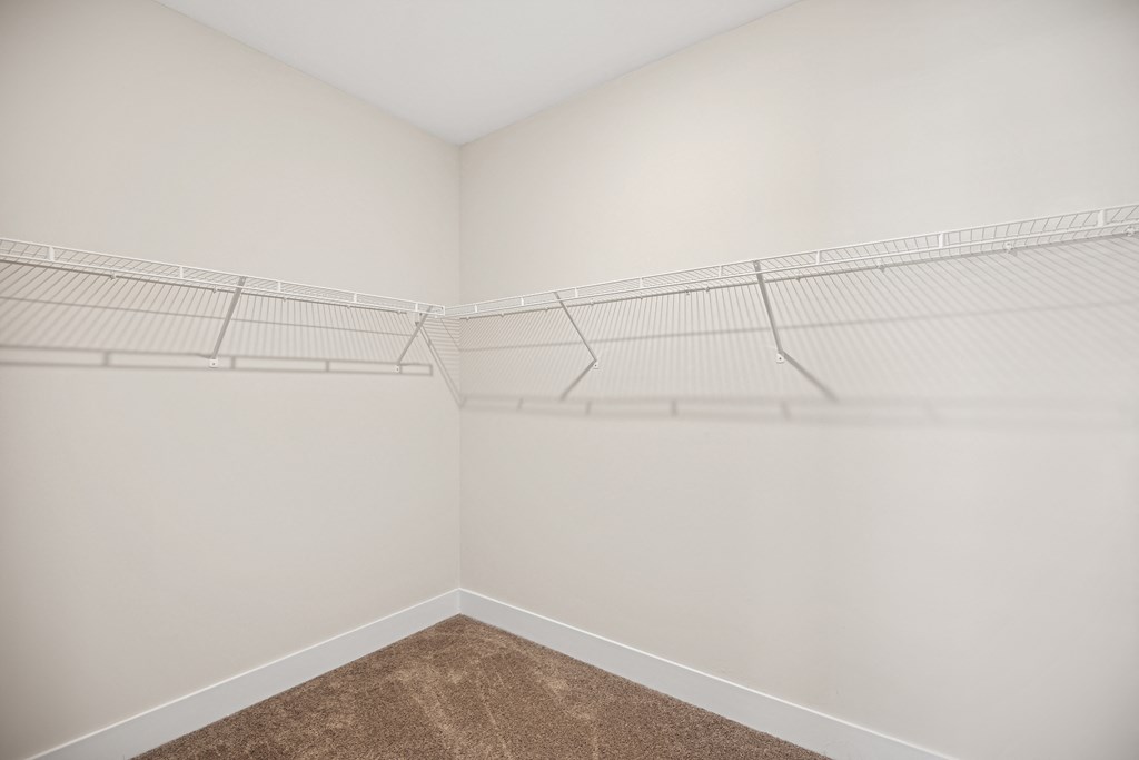 an empty closet in a home with white walls and shelvesat Centro at Pine Nash, Wilson, NC, North Carolina, 27893