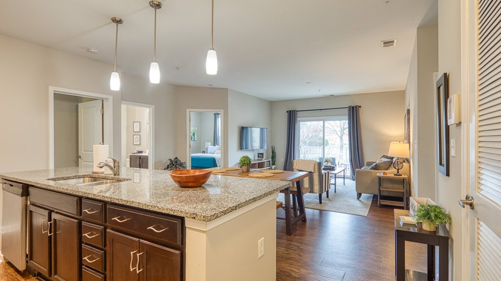 an open floor plan with a kitchen and living room
