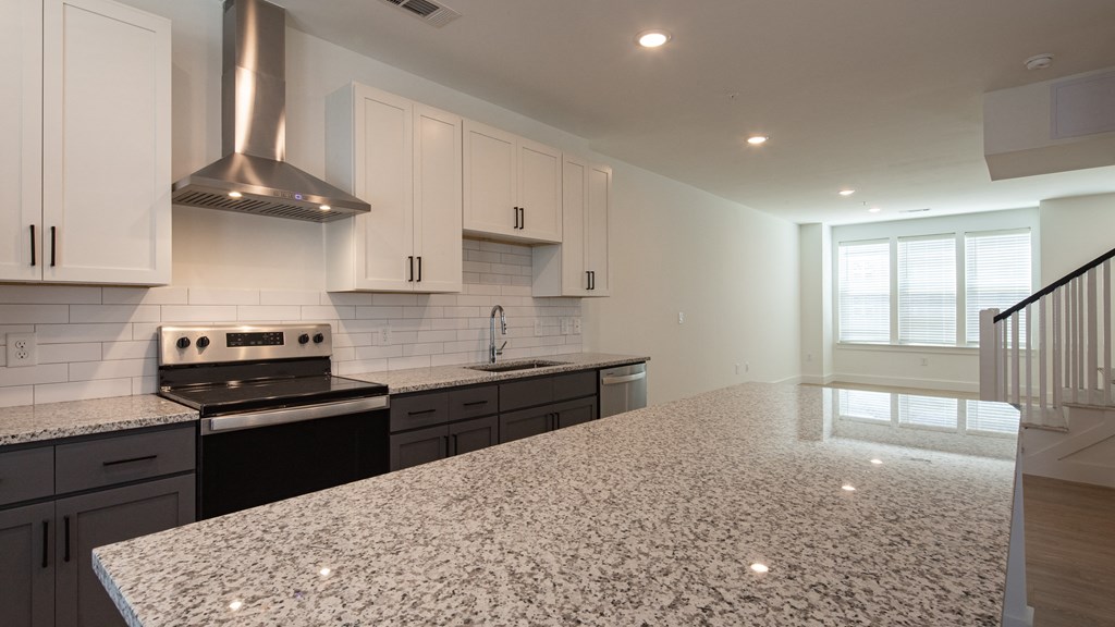 a kitchen with white cabinets and black appliances at Ainsworth, Virginia,3228
