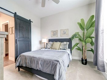 Bedroom at The Delaneaux Apartments in New Orleans LA - Photo Gallery 18