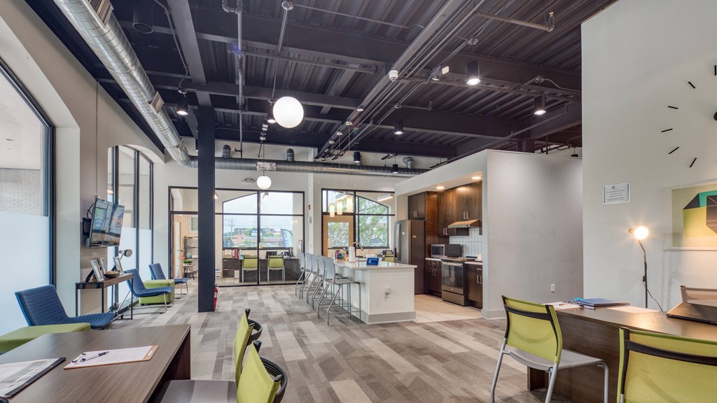 an open concept office space with a kitchen and dining area at The Hudson, Richmond, VA