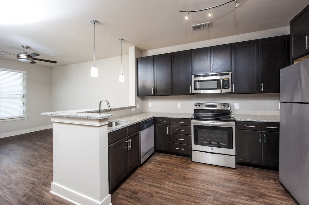Modern Kitchen With Custom Cabinet at The Lincoln Apartments, North Carolina