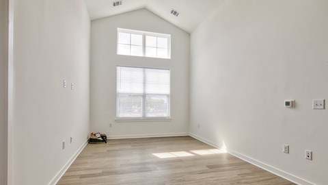 an empty room with white walls and a window at Allure at Edinburgh, Chesapeake, VA, 23322