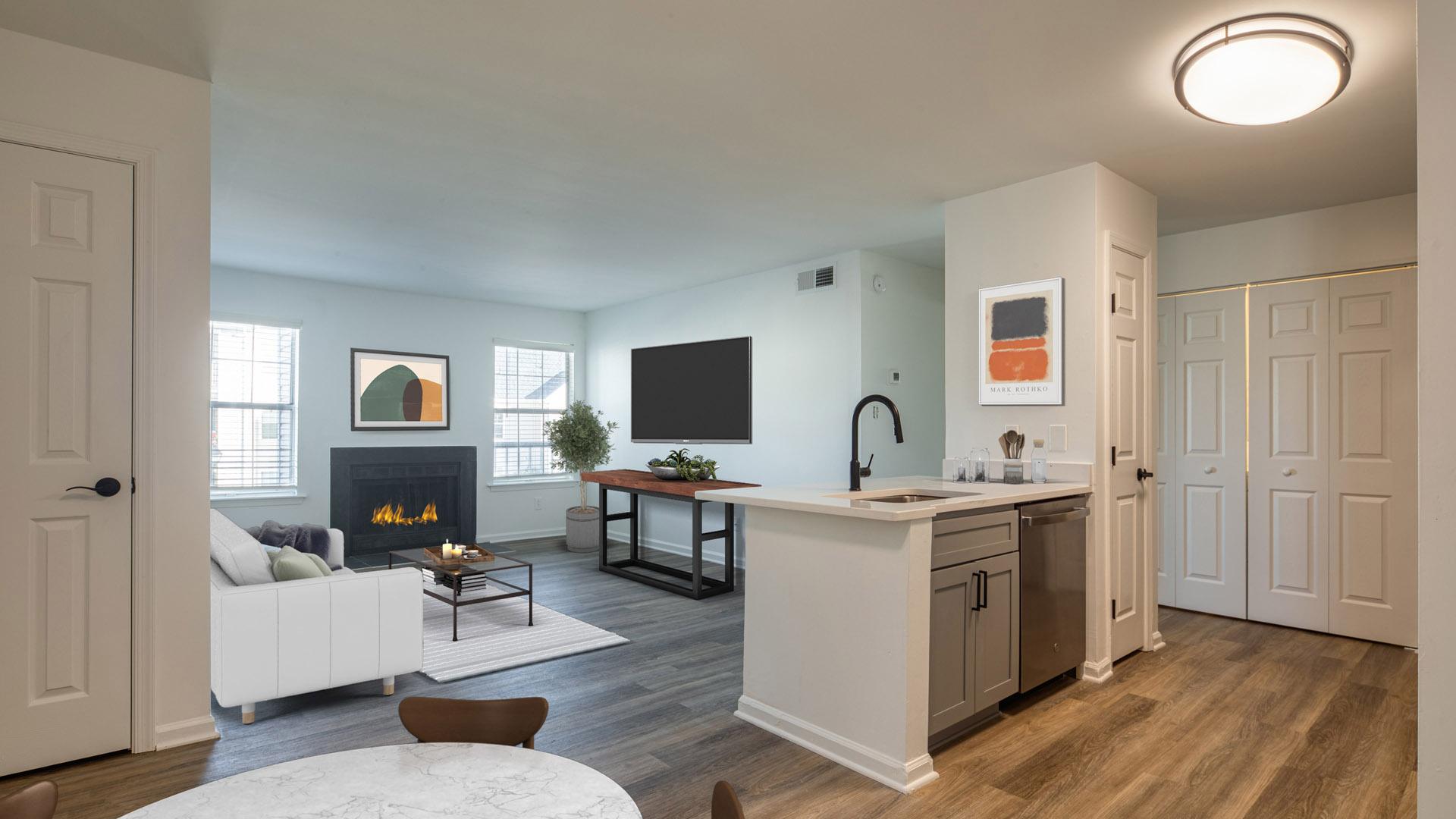 A modern living room with a fireplace and a television.
