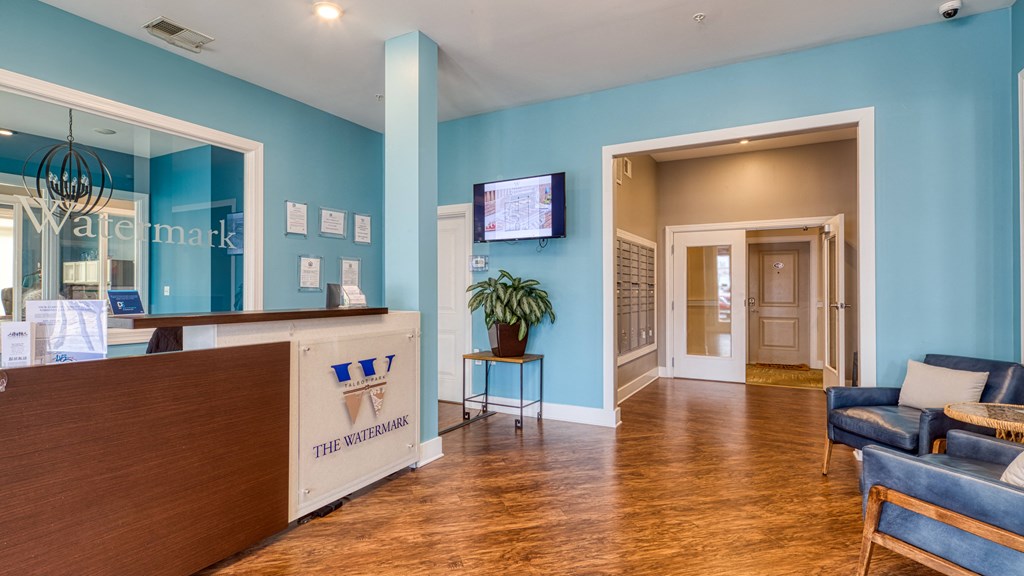 a lobby with blue walls and a reception desk