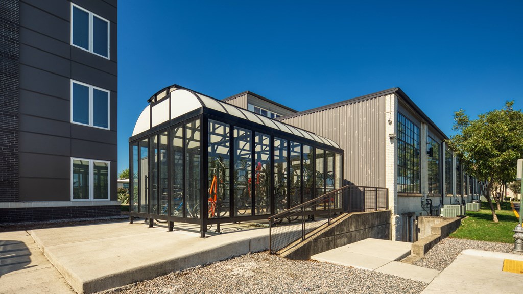 a greenhouse on the side of a building