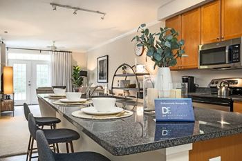 a kitchen with a counter top with plates on it
