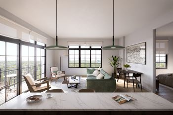 A modern living room with a large window and a view of the city.at Aviator Lofts, Newport News, VA 23602