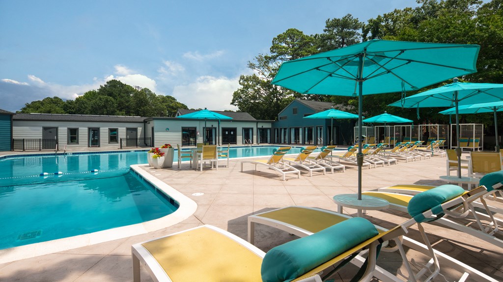 Swimming Pool with Lounge Chairs and Umbrellas at Acclaim at Carriage Hill, Richmond, 23228
