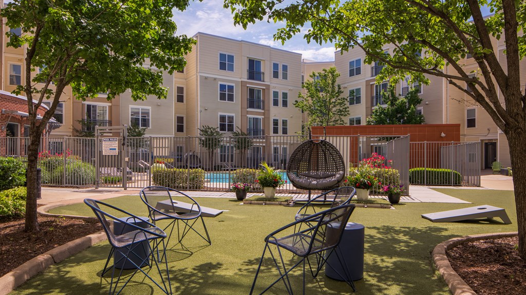 a courtyard with tables and chairs at Proximity at ODU, Virginia, 23508