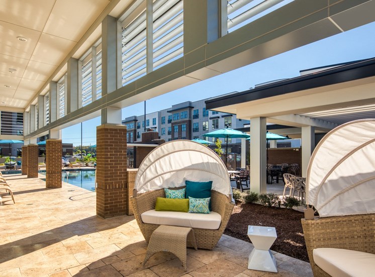 Seating at Lumen Apartments pool