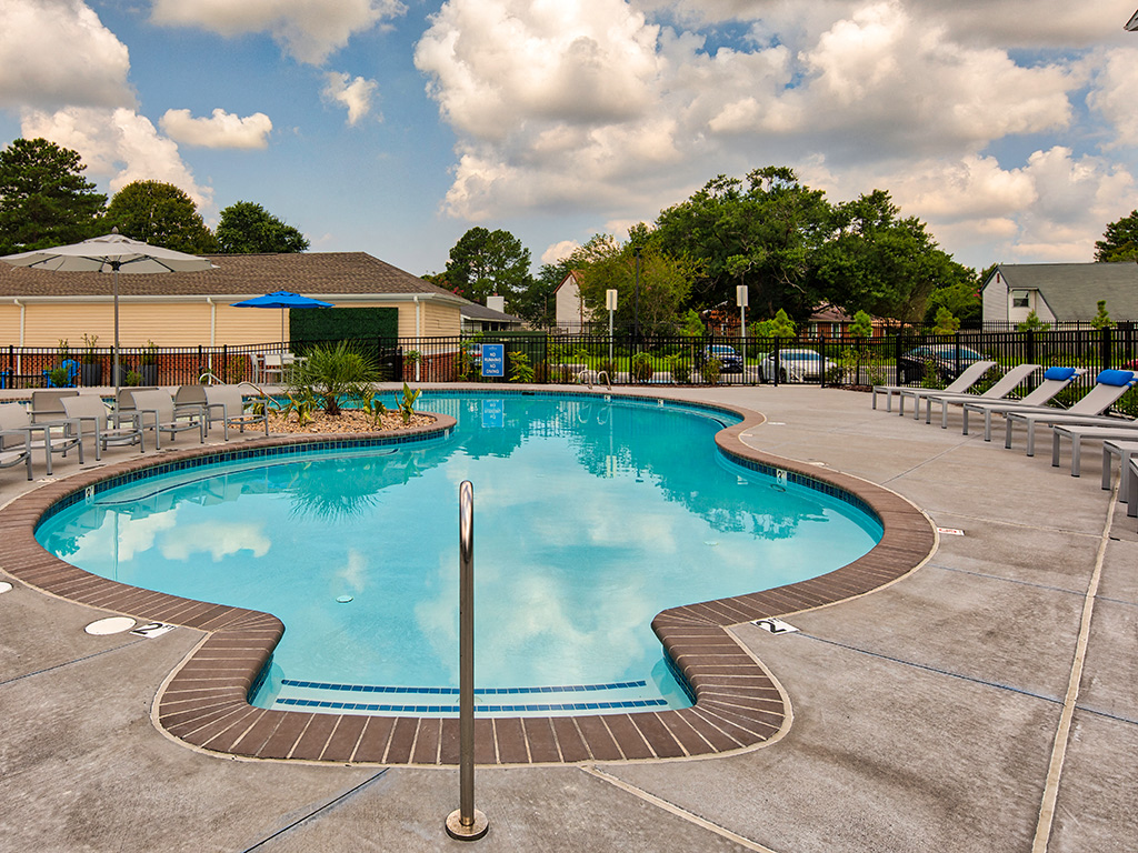 Pool and chairs at The Choices at Holland Windsor Apartments