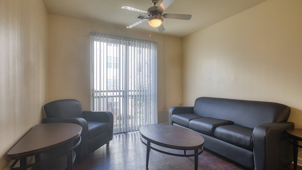 living room with a couch and a table at Proximity at ODU, Virginia, 23508