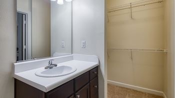 apartment bathroom with sink and shower