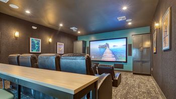 a conference room with a table and chairs and a tv on the wall at Allure at Edinburgh, Virginia