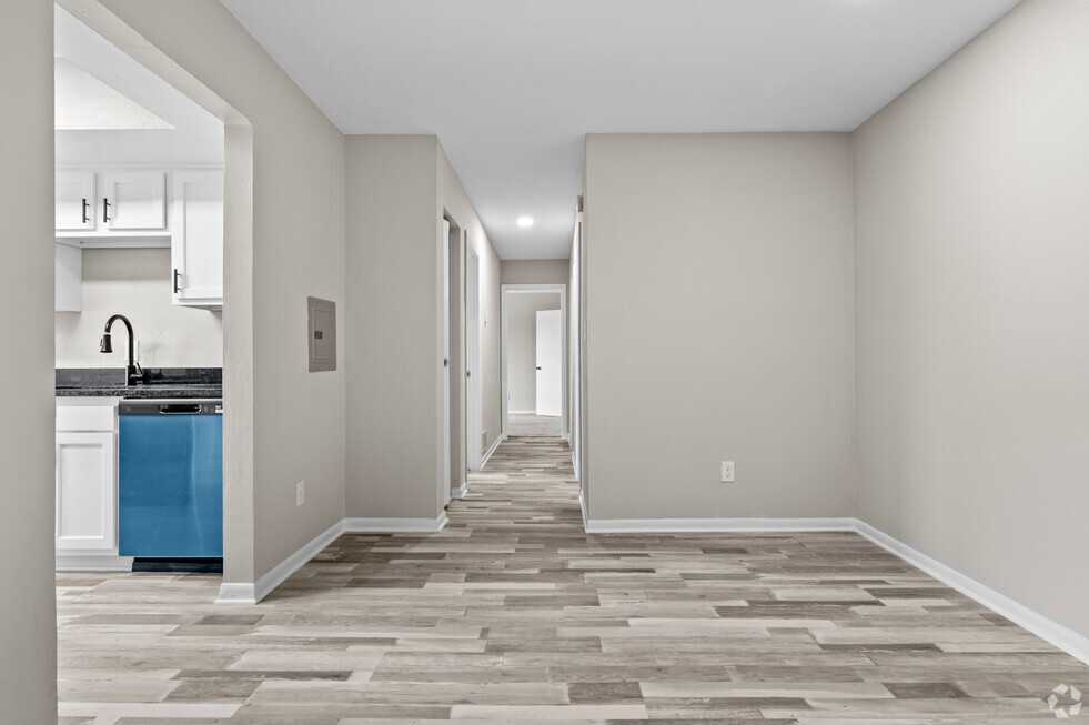 a renovated living room and kitchen in a new home at Bayville Apartments, Virginia, 23455