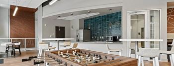 a close up of a machine with rolls of steel and other machineryat Metropolis Apartments, Glen Allen Virginia