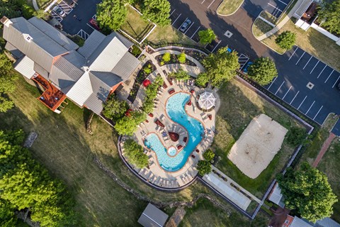 an overhead view of a swimming pool in a backyard with a house and a neighborhood at The Charleston, Ohio