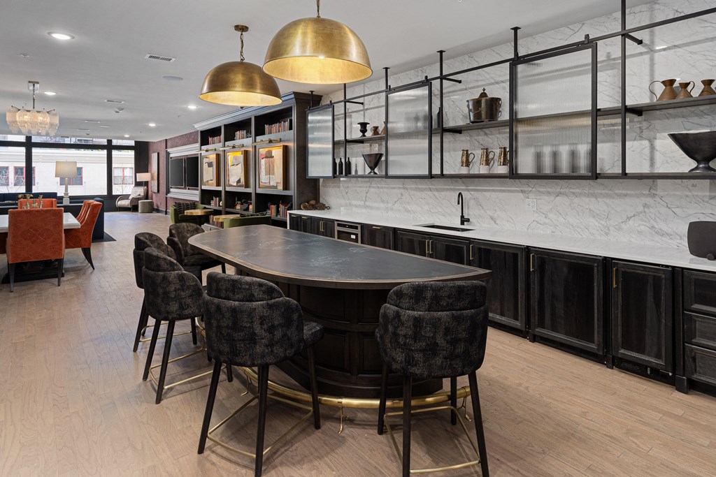 a kitchen with a large table and chairs in a restaurant at The Madison, Columbus, Ohio