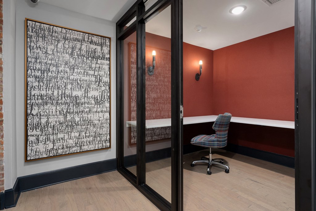 a conference room with a chair and a painting on the wall at The Madison, Columbus, Ohio
