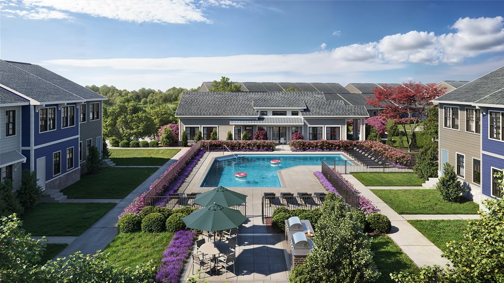 A large house with a pool in the backyard.