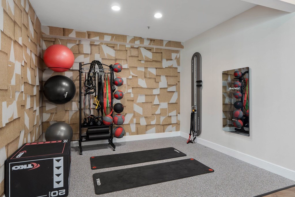 A gym room with a variety of exercise equipment. at The Orchard, Dublin, OH