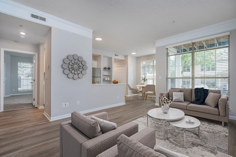 A modern living room with a large couch and a coffee table.